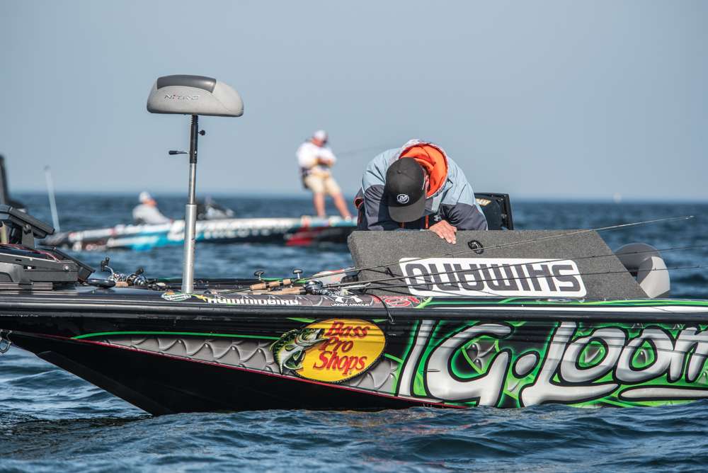 VanDam reaches into his rod locker to grab another pole. 