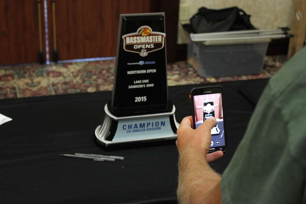 A co-angler keeps his eyes on the prize and snaps a photo of what he would like to take home later this week.