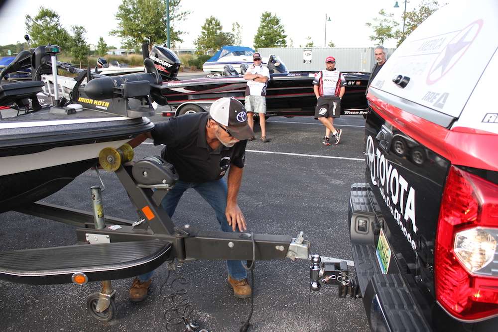 B.A.S.S. tournament officials back Toyota Tundras up to anglers boats in preparation for a drive-thru weigh-in.