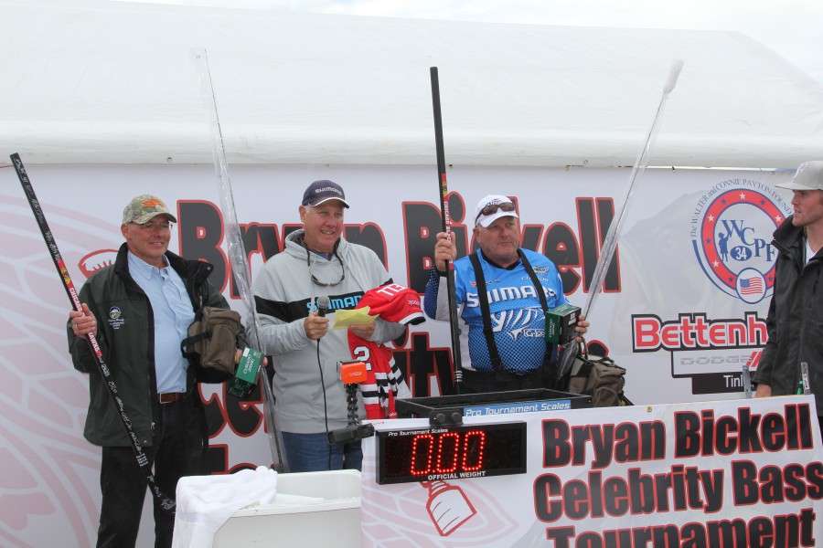 Dave Kranz, owner of Dave's Bait & Tackle in neighboring Crystal Lake, and his team show off their second place prizes which included Plano tackle bags and organizers, Shimano and G. Loomis tackle, and signed memorabilia from the world champion Chicago Blackhawks.