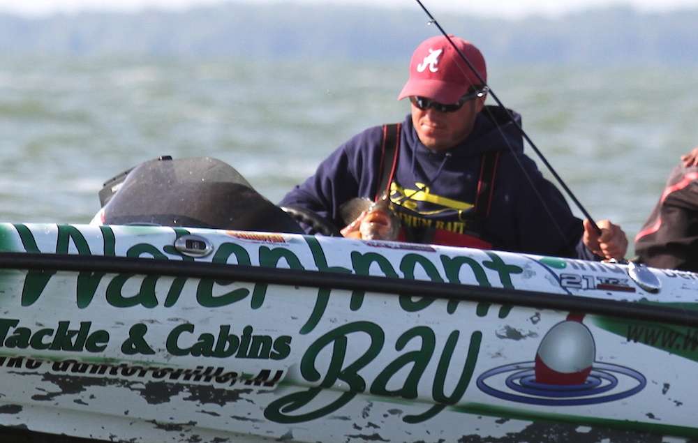 Remitz hugs a 4-pound smallie into the boat. 