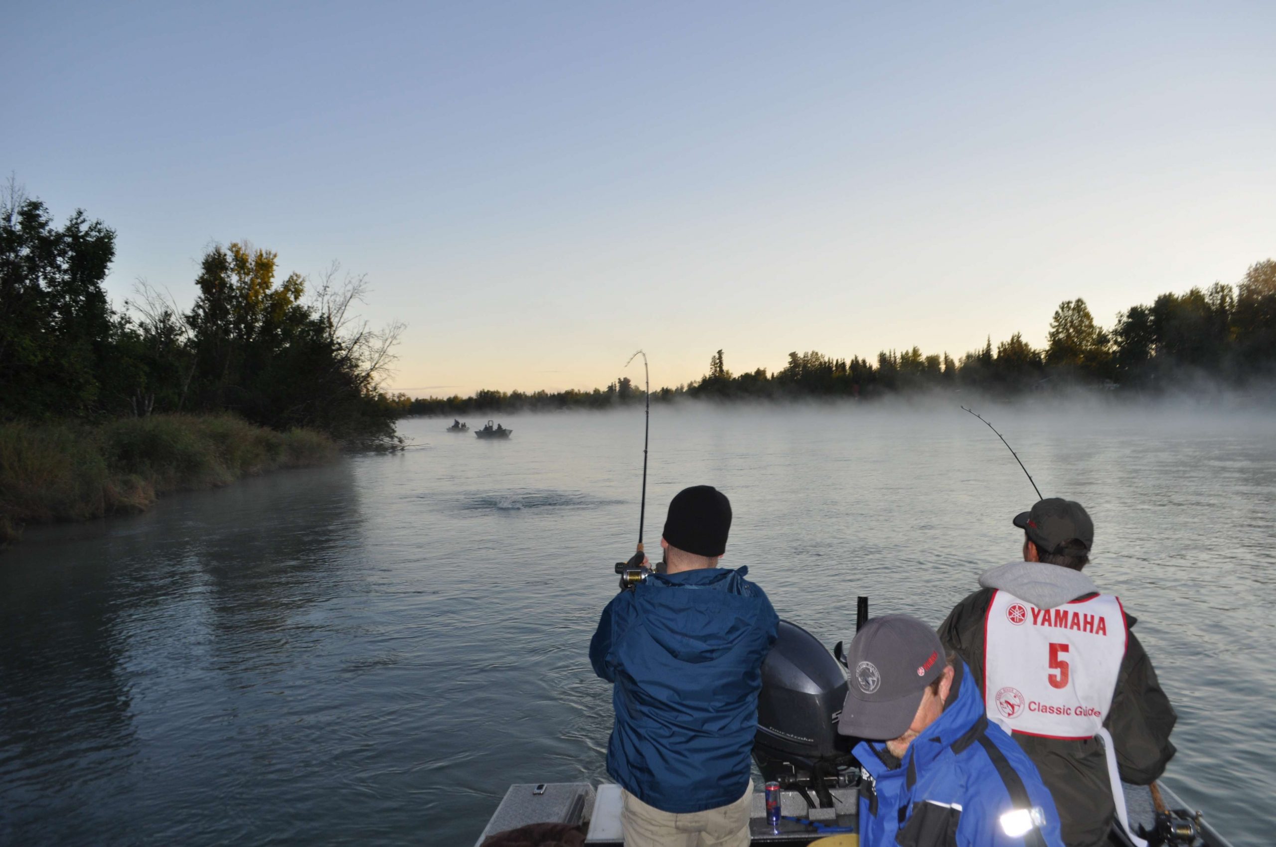 An angler battles a big silver salmon during the Kenai River Classic, a fundraising event for conservation projects of the Kenai River Sportfishing Association (KSRA).