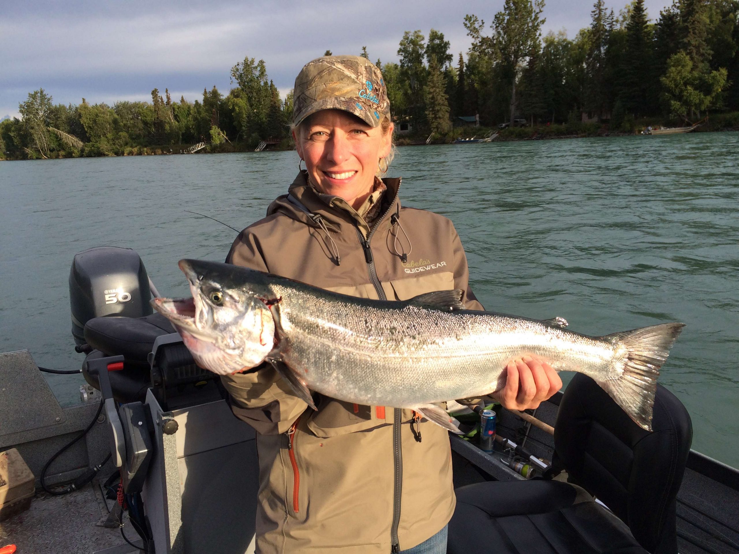 Kenai River Classic contestant Carri Ann Pratt of Cabelaâs in Anchorage shows off a big silver salmon.