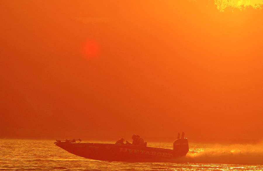 Stephen Browning speeds to his first fishing spot as the sun begins to rise on Day 1 on Fort Gibson.