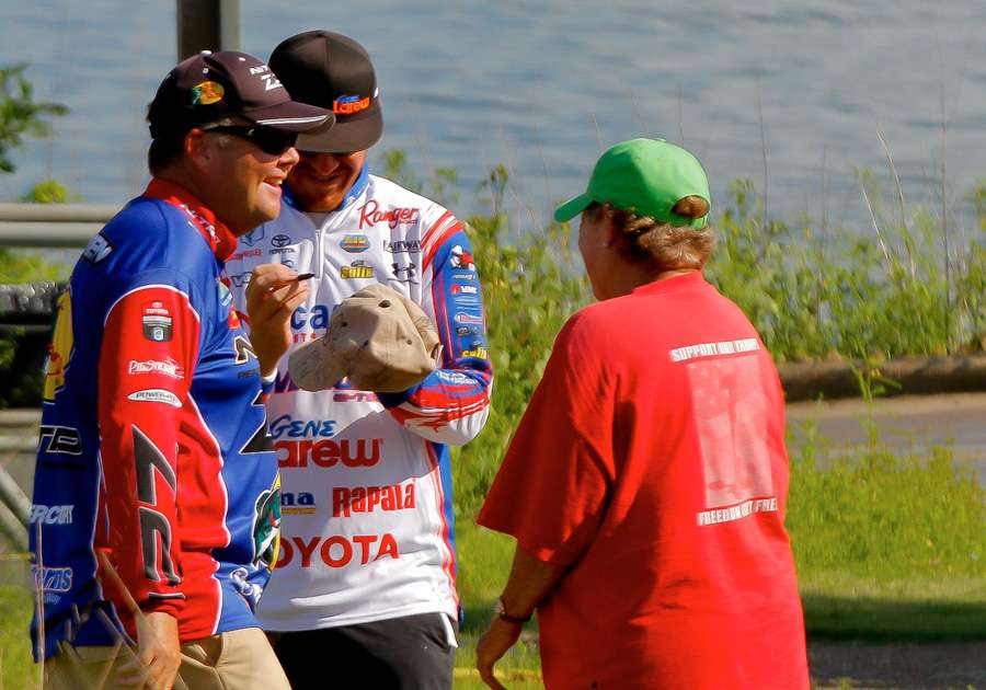 Brian Snowden and Jacob Wheeler signed autographs after weighing their fish. 