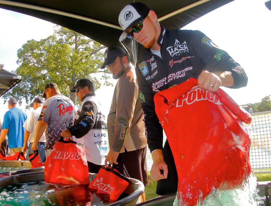 Josh Bertrand moves along the holding tanks with a bag of fish that would leave him in fifth place with 17 pounds, 1 ounce. 