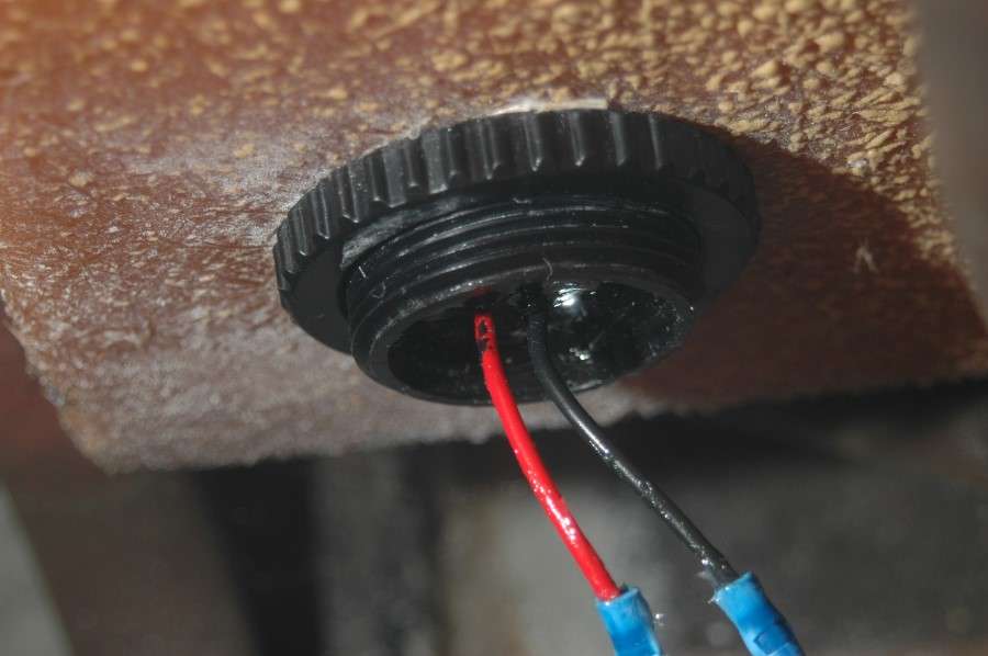 On the outside of the livewell, tighten the plastic nut securely to prevent leakage. I attached 14-gauge wire to the leads from the unit and connected them to an accessory switch on my console.