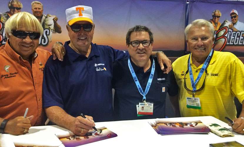 Jimmy Houston, Bill Dance and Roland Martin pose with the author at their 2015 ICAST booth, Th3Legends.