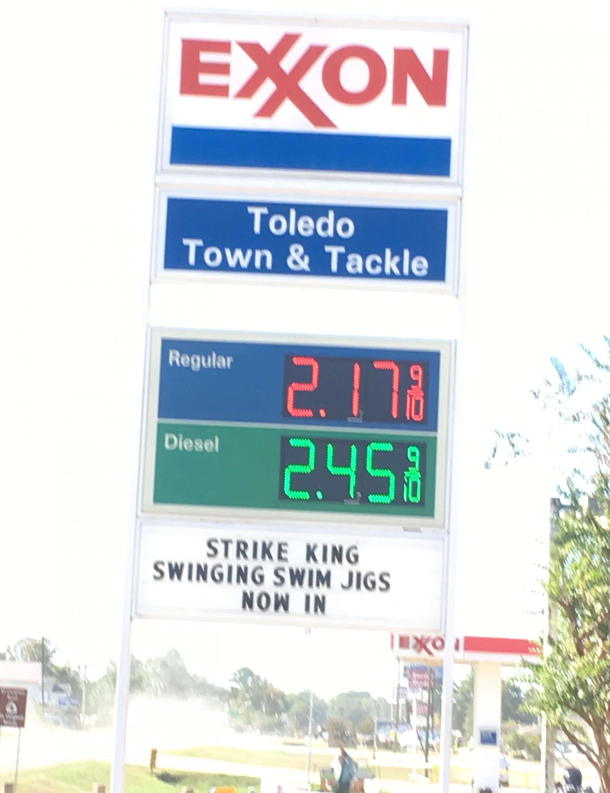 <p>Pulling into town, just a few minutes from Cypress Bend Resort, this is the kind of sign that bass fishermen love to see: Moderately inexpensive gas prices and new baits for sale!</p>
