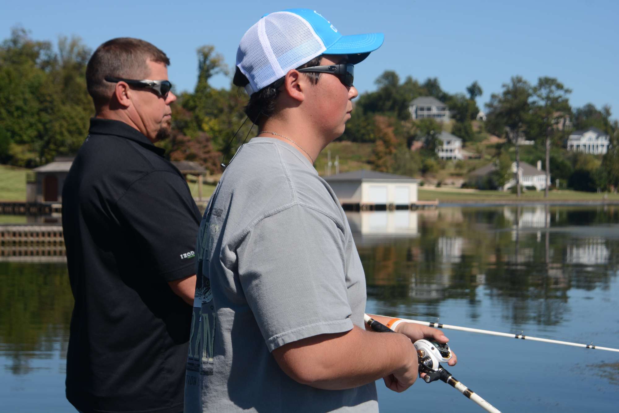 Lane instructs Ballard every step of the way, giving him suggestions on where to cast and how to reel in just right.