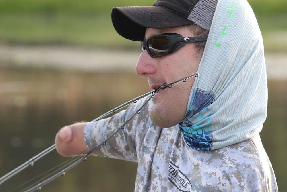 Most anglers get frustrated when their rods get tangled, Dyer just takes care of business and gets back to it. 