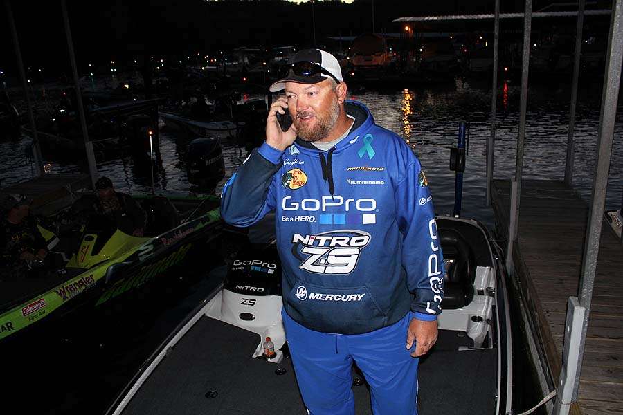 Greg Yates talks to his co-angler about meeting at the dock for the day. 