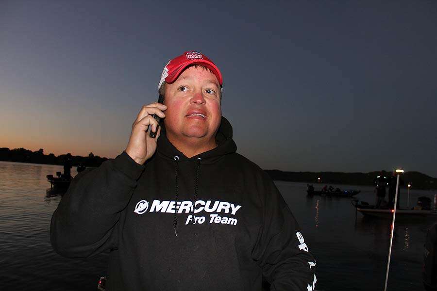 Leader James Watson takes a phone call from a friend wishing him the best of luck on Table Rock.
