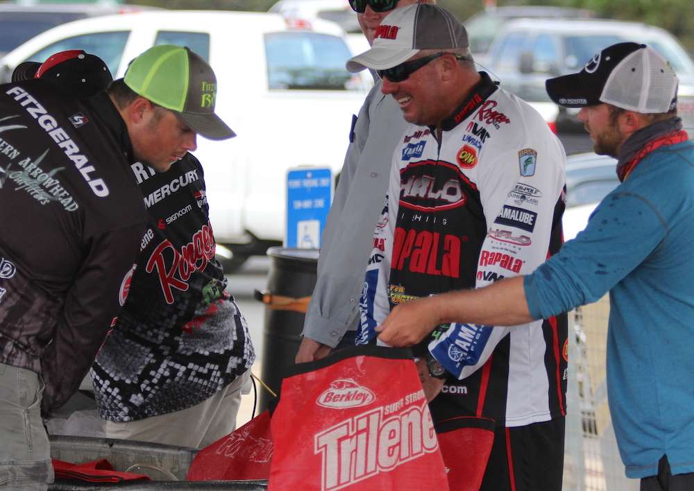 Trevor Fitzgerald checks out Travis Kelehan's big one in the bag, a 7-13 giant. 