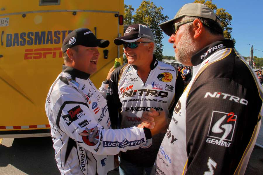 After taking the lead, James Watson gets congrats from his friends and fellow competitors, Kelly Powers and Greg Ryan. 