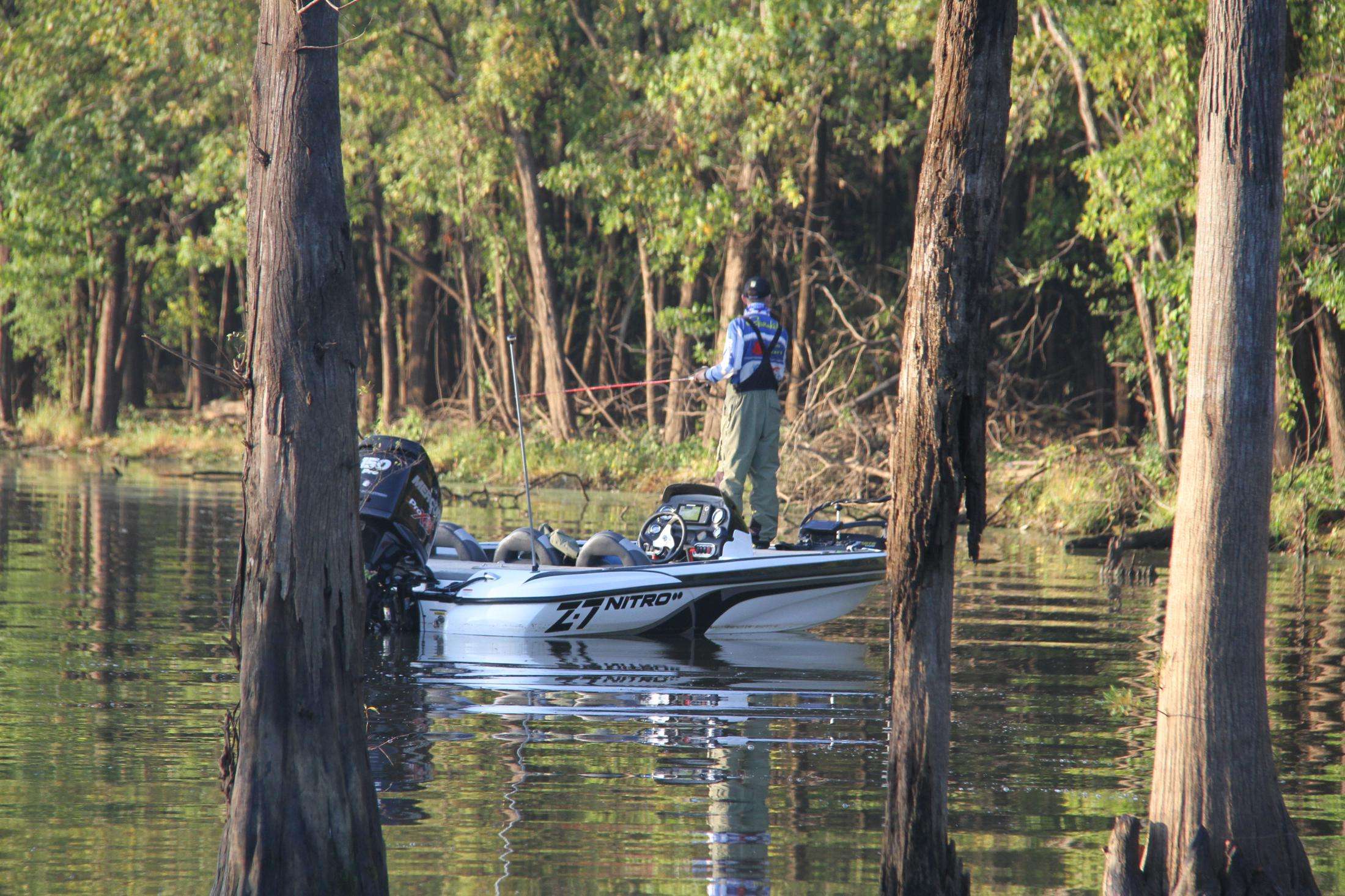 Alec Williams of Namibia works a cypress stand looking for his first fish of the day.