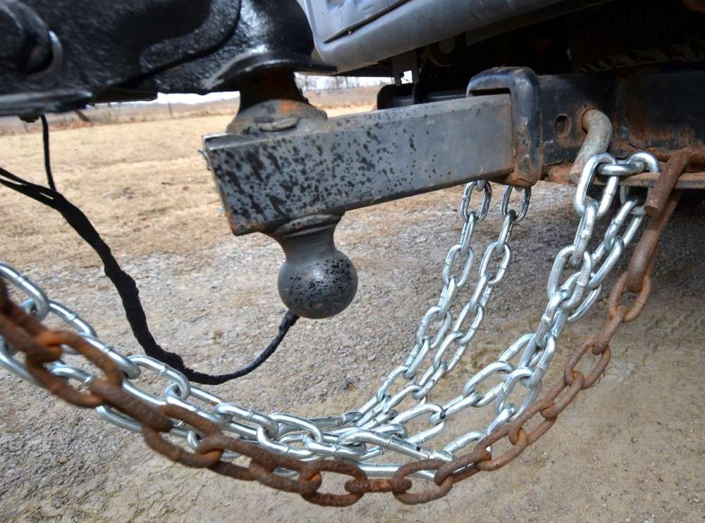 The rusty safety chain in the foreground is one of two that came with my boat trailer. I replaced it with new, heavier chain.