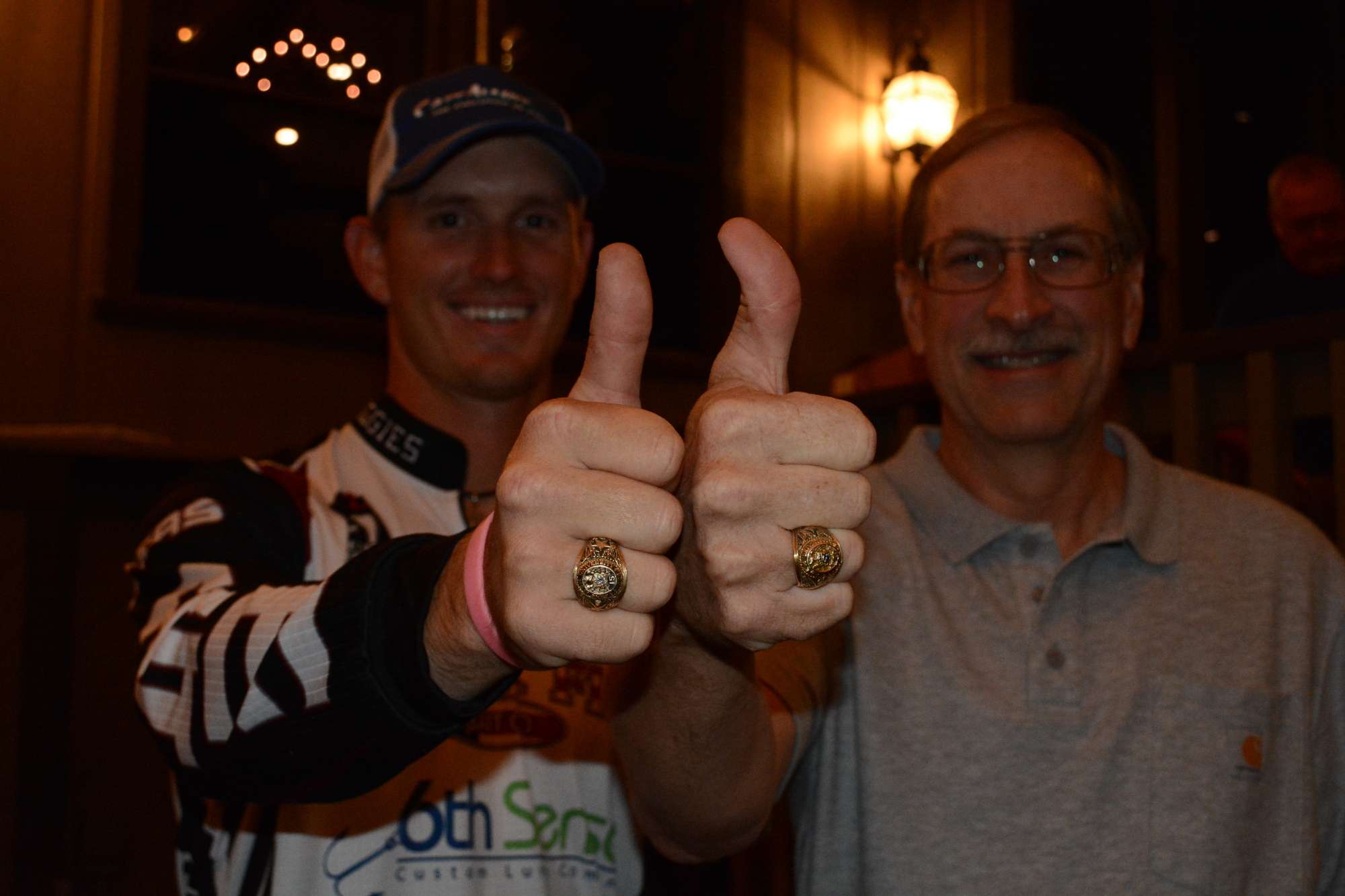 McArdle and Gilliland show off their nearly identical class rings, even though they're separated by a few decades. (Bensema will get his ring closer to his graduation date.)