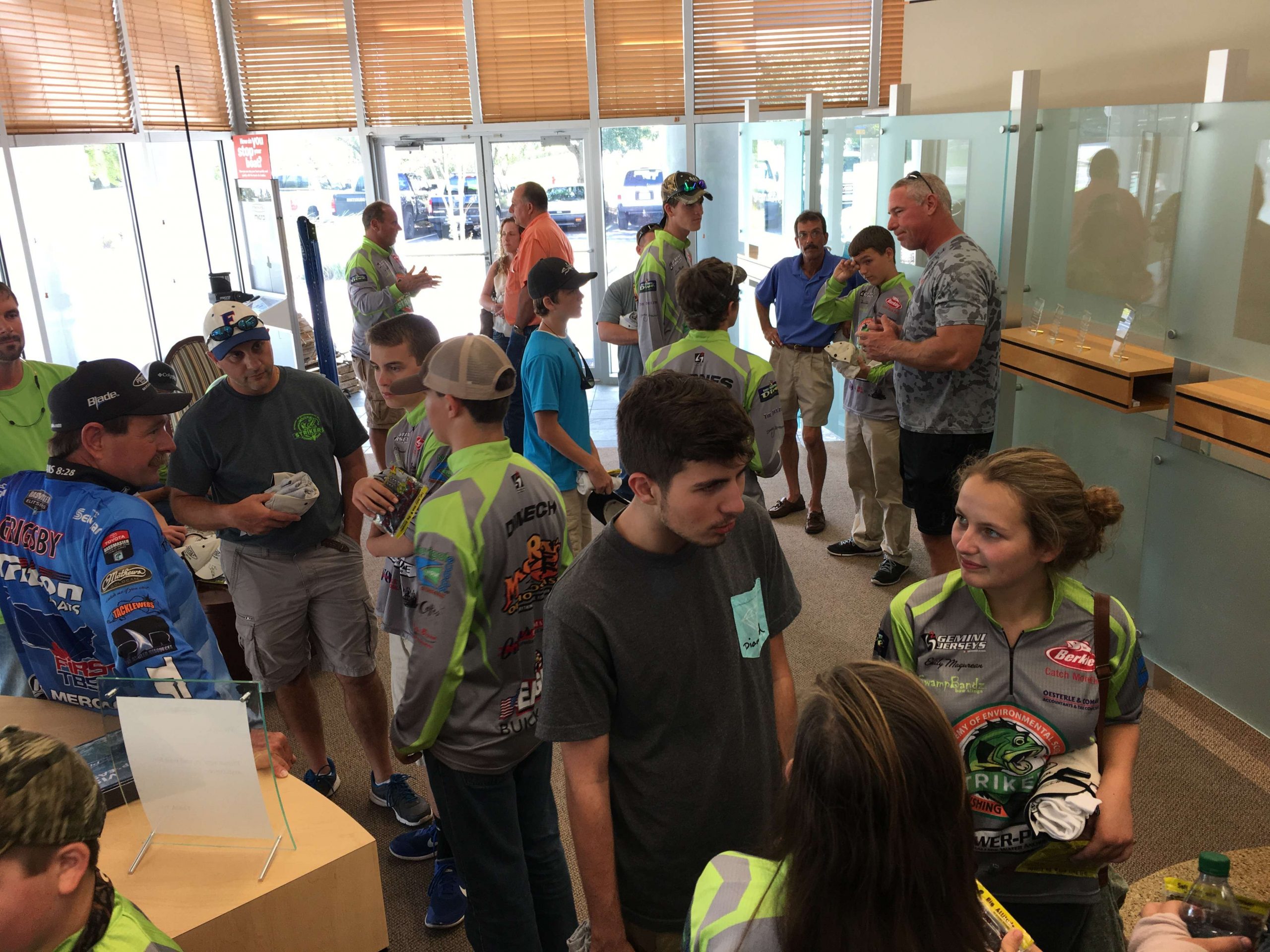 JL Marine offers guided tours through its production facility. Here, company personnel, along with Elite Series pro Shaw Grigsby, greet a visiting group of students from Crystal River, Fla.