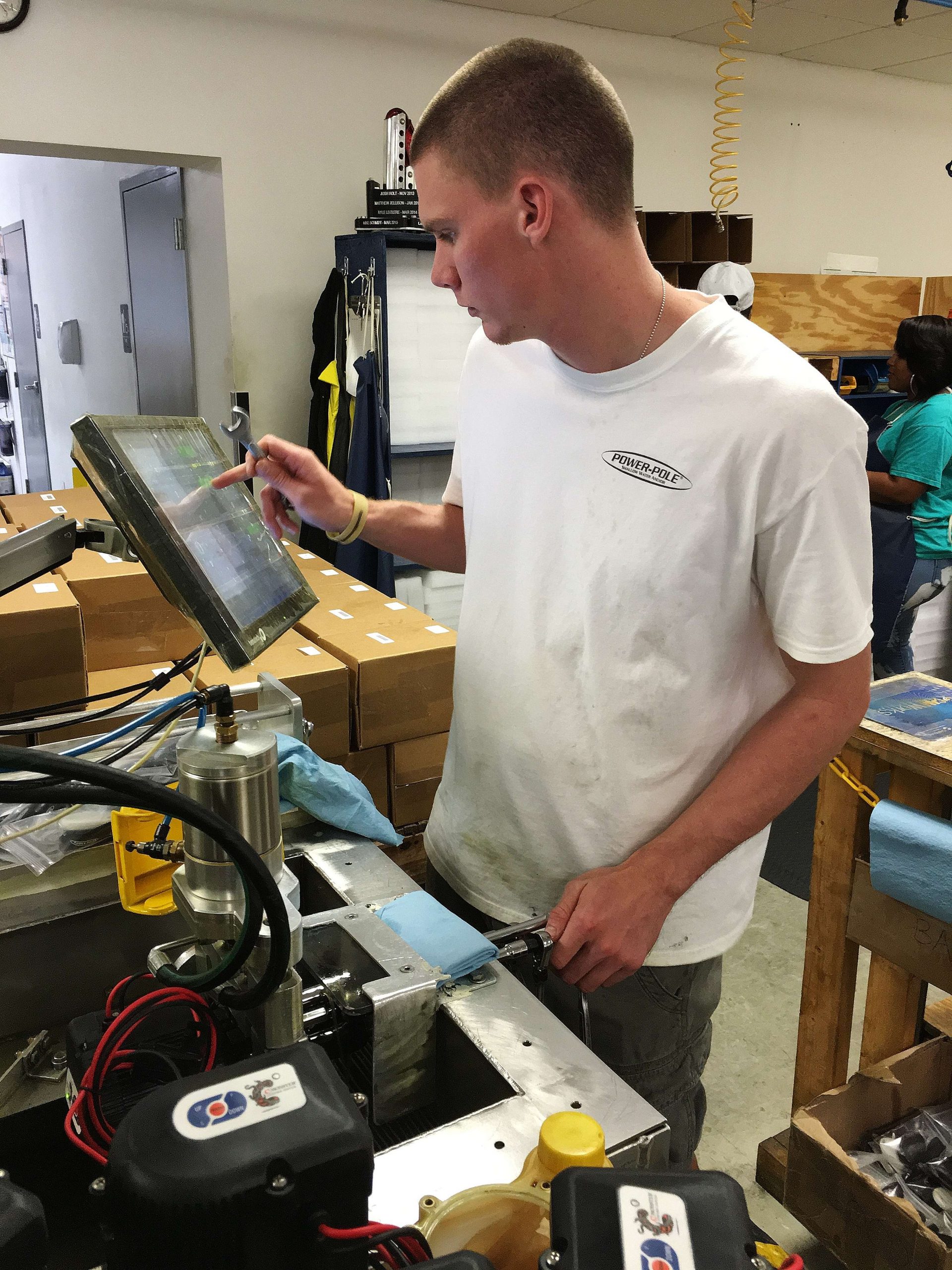 While some components are receiving paint, others enter testing and assembly. Here a technician makes sure the pumps adhere to the companyâs performance standards.