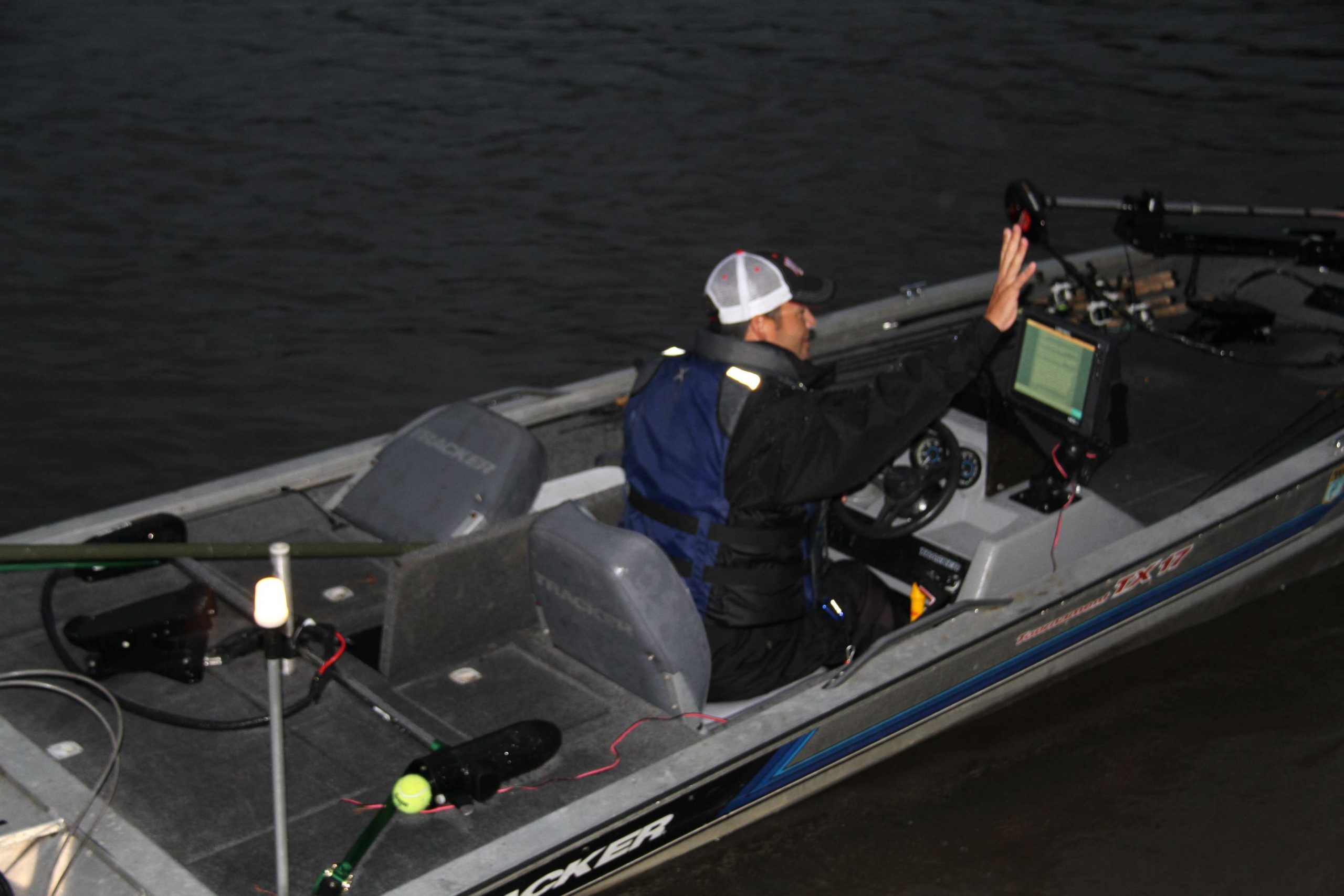 The leader after Day 1, Jamie Laiche of Louisiana, waves to fans as he hits the Ouachita River.
