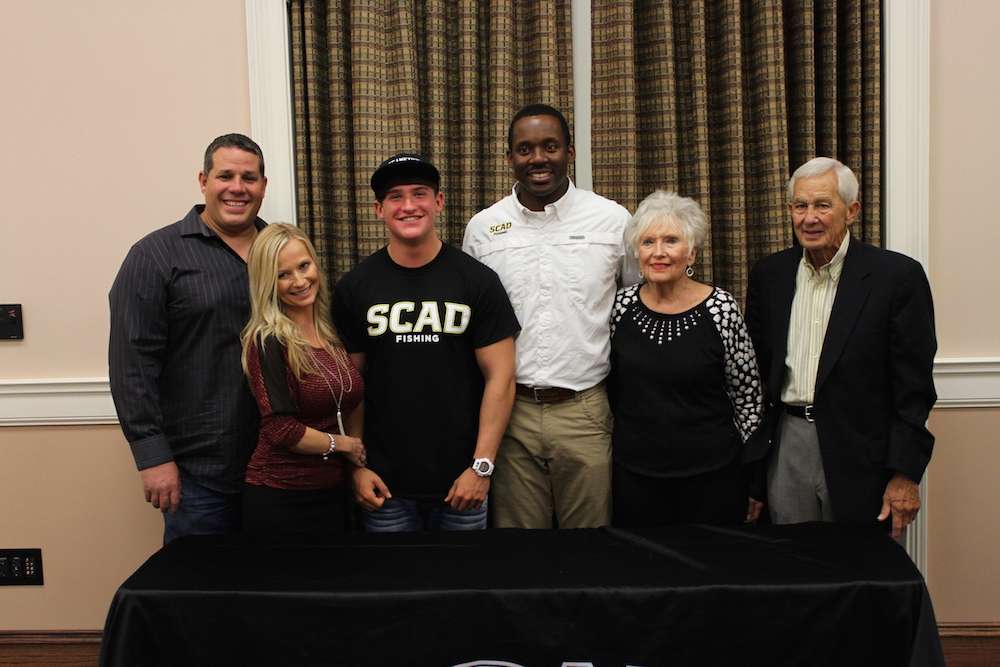 Payne joins in the family photo as Pescitelli is the first male angler to sign with SCAD.