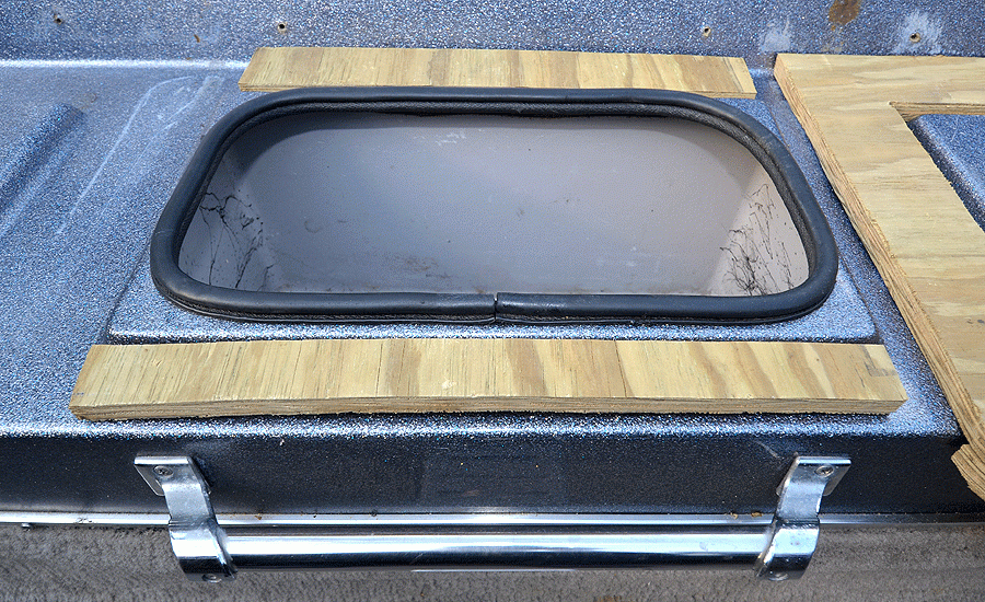 The middle fold-down seat that covers the cooler did not extend past the bench. Two pieces of 3/4-inch plywood provided the flat surface needed for a proper fit.