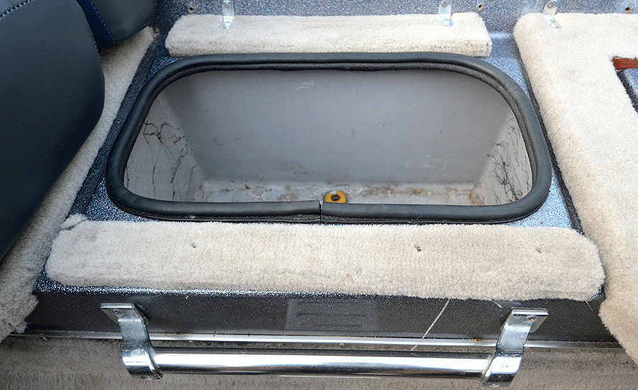 The base in front of the cooler is secured with long screws. I secured the base in the back with steel L brackets and short stainless steel screws that would not penetrate the livewell behind the bench or the cooler below it. There is no wood behind the fiberglass in these areas.