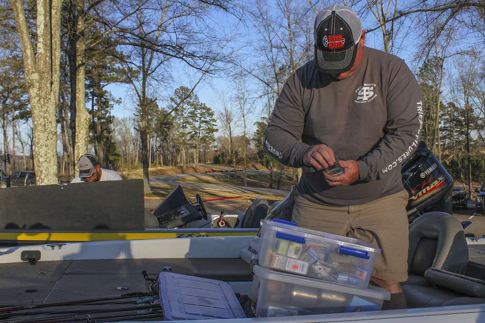 Other anglers prepare tackle before the registration begins. Shane Lineberger, who will be a 2016 Bassmater Elite Series rookie, finetunes his equipment. 
