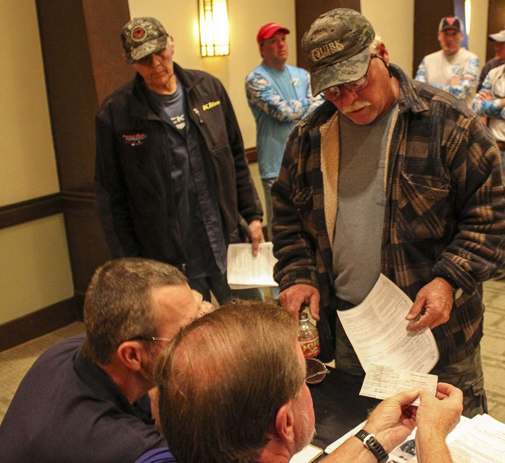 Anglers show B.A.S.S. officials their fishing licenses and other necessary paper work.