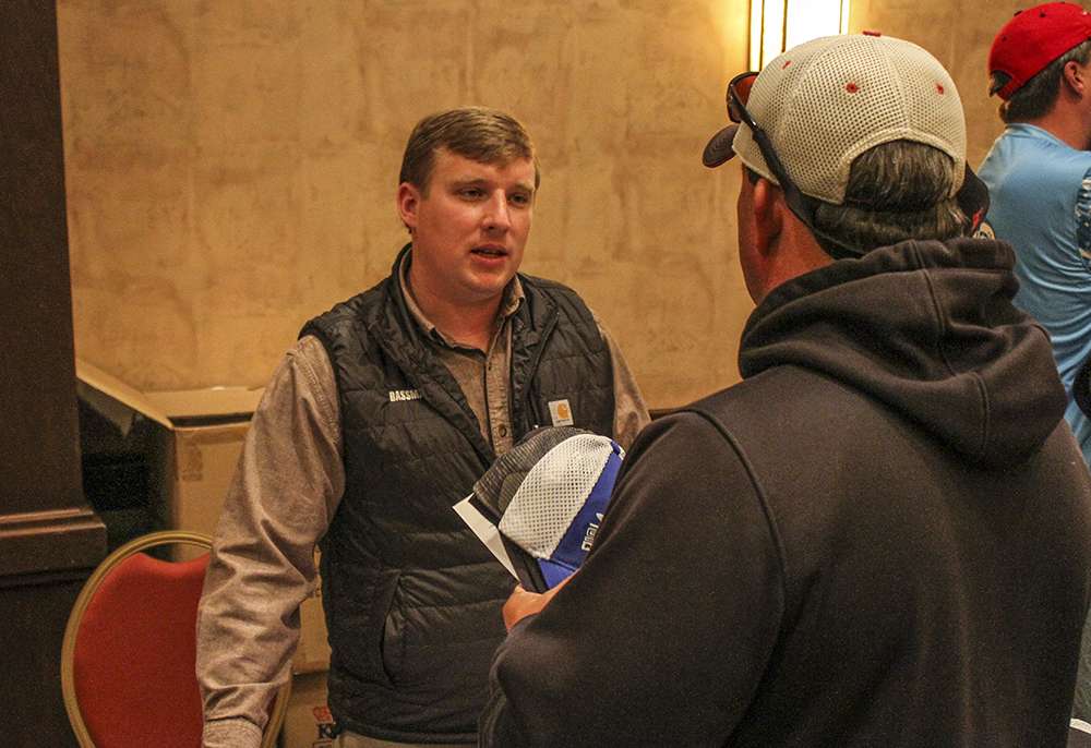 Hank Weldon speaks with anglers, answering any questions they might have.