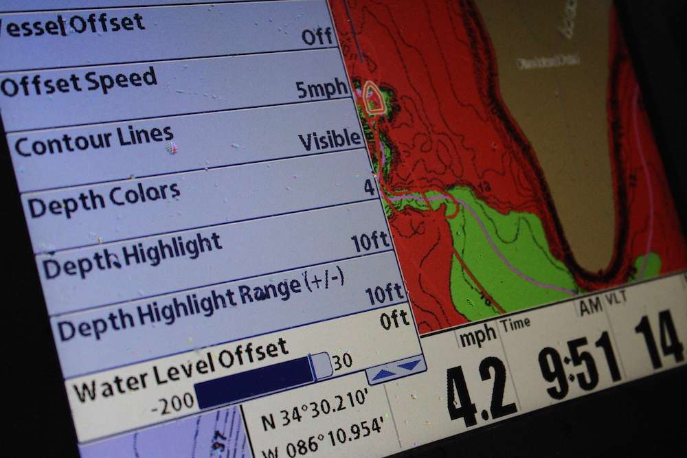 In the menu of his Humminbird 1199, Scroggins set his preferred shaded depth to 10 feet, which means everything 10 feet and shallower is shaded in red.