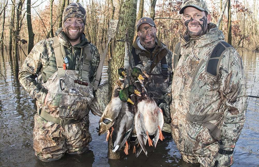 VanDam, Morris and Russ Campbell pose with a morning stringer of mallards.
