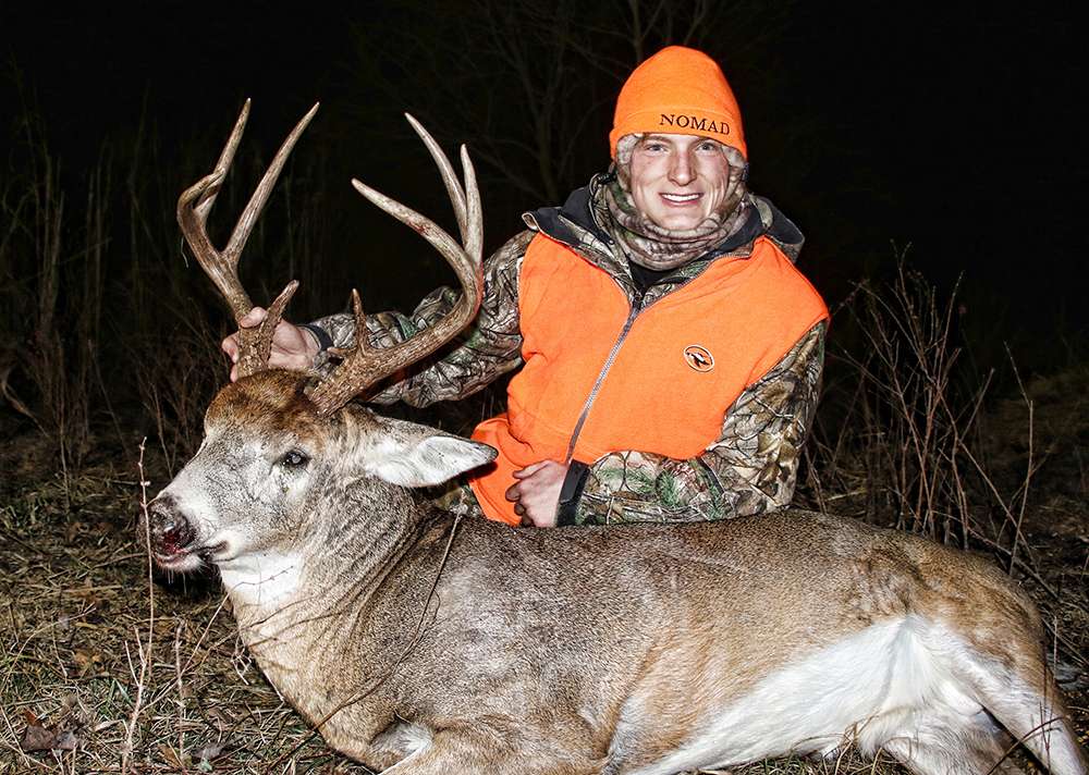 Jackson VanDam poses with an 8-point he killed in Kansas during the opening day of gun deer season.