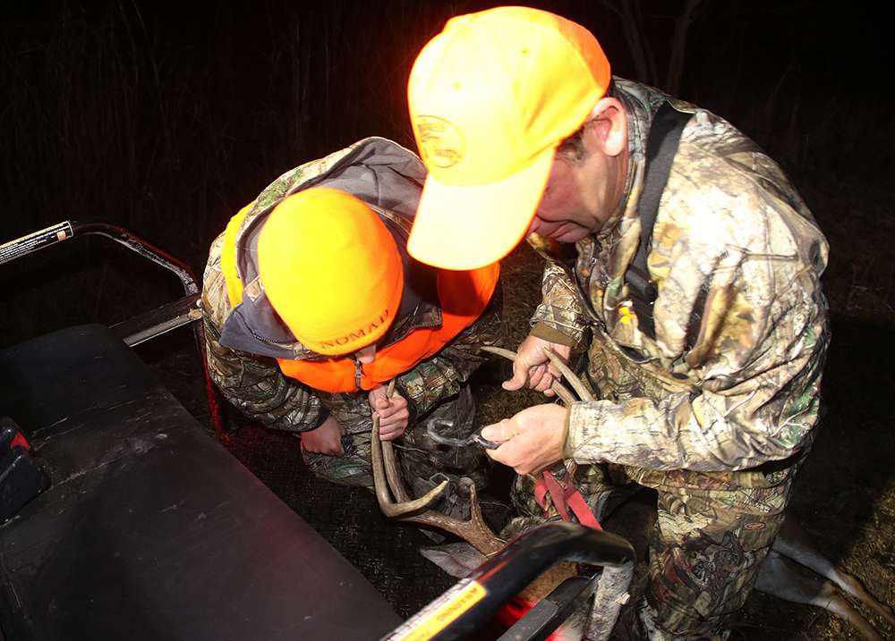 KVD and Jackson work together to get the deer out of the field.