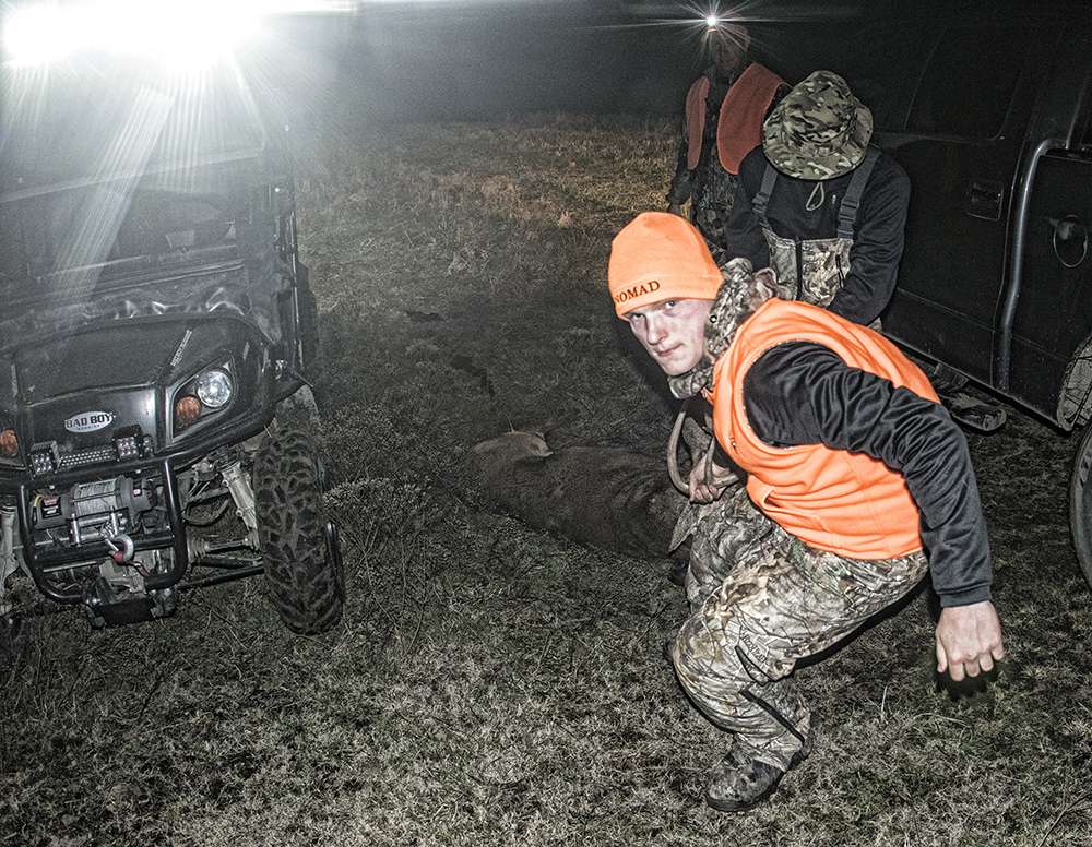 Once dressed and tagged, brother Nicholas would help load the deer. 
