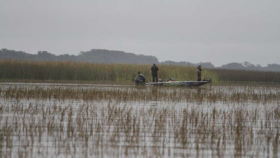 We see another angler nearby in a solid grass field. He was methodically probing the grass for a big Florida bass.
