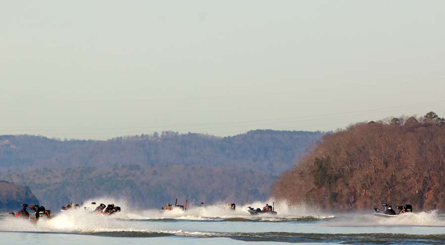 Kevin VanDam is chased by a small flotilla of spectator boats on Kentucky Lake. 