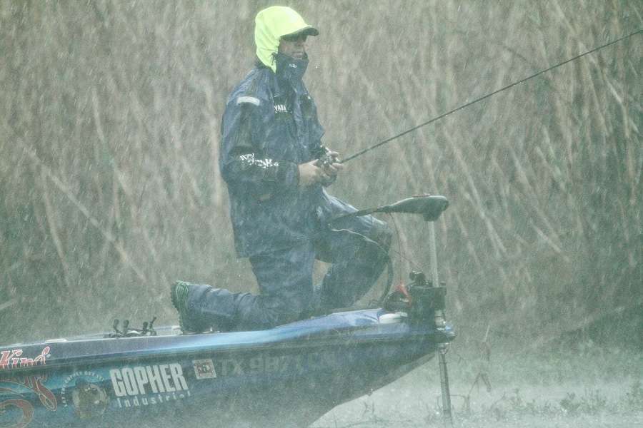 With lightning strikes in the area, Todd Faircloth fished from his knees to present a lower profile. 