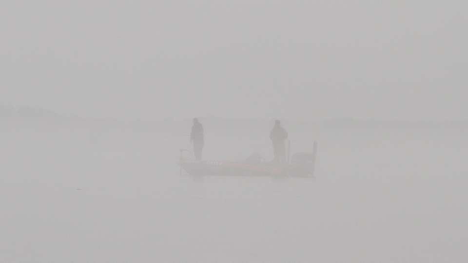 At times walls of fog would move across the lake, making it difficult to identify who we were photographing. 