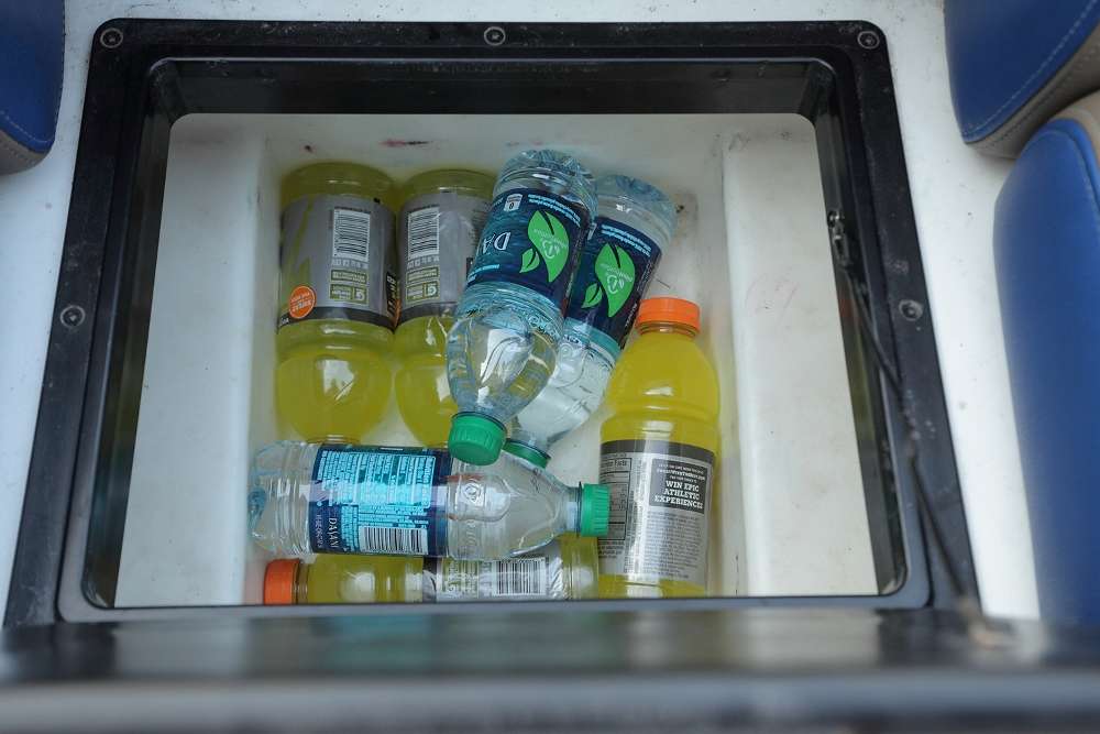 The typical cooler filled with drinks and snacks.