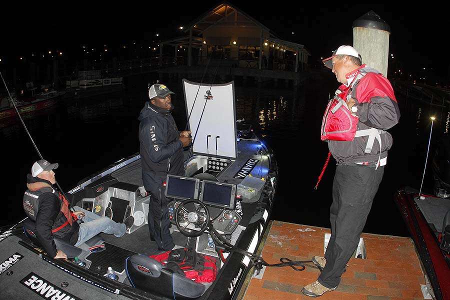 Monroe gets advice from Florida pro Terry Scroggins who is in 9th place just one spot ahead of his fellow Bassmaster Elite Series pro.
