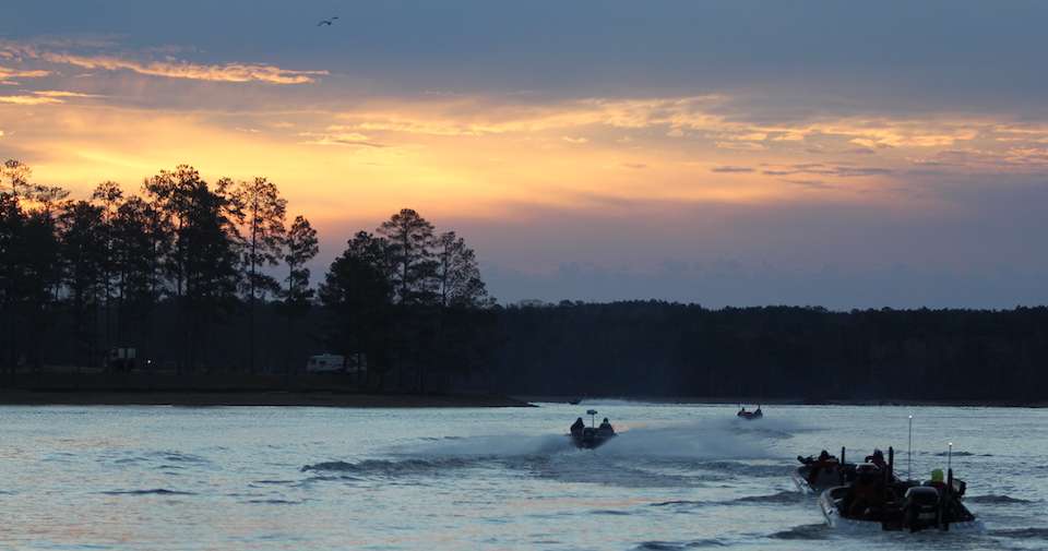 A beautiful sunrise beckons to the anglers as they head out on Lake Martin. 