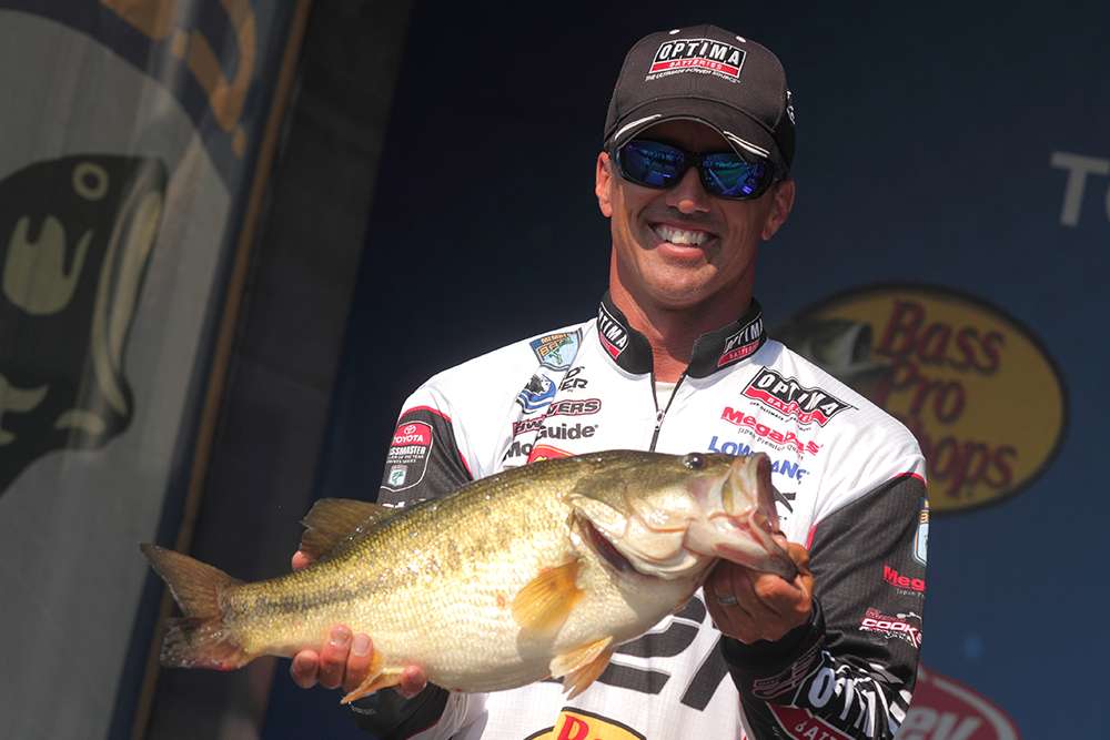 Evers shows off his 8-11 bass. Big fish every day helped him to victory.