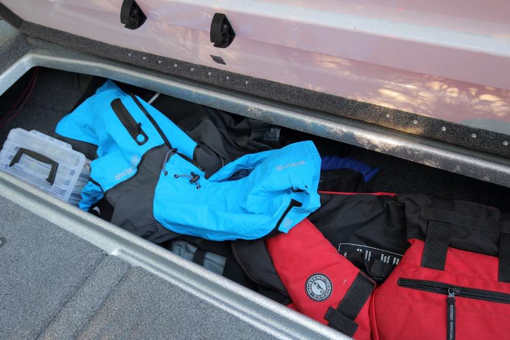 A storage compartment on the right side of the boat holds extra clothing, life jackets and a smaller box for tackle.