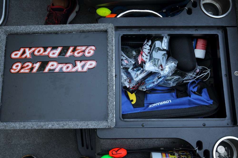 The storage compartment between the seat holds bags of spare Havoc soft plastics, sunglasses and a blue Lowrance bag. Lucas uses the bag as a toolbox. 