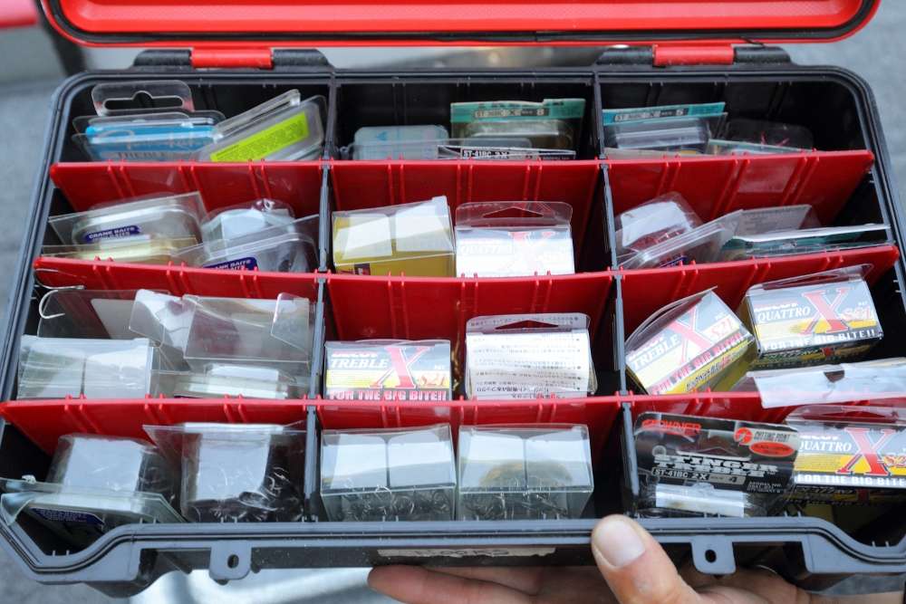 Lucas stores his treble hooks in the original packaging inside a deep Bass Mafia Coffin box. Like the other box of hooks, Lucas chose this storage method because it is sturdy and waterproof.
