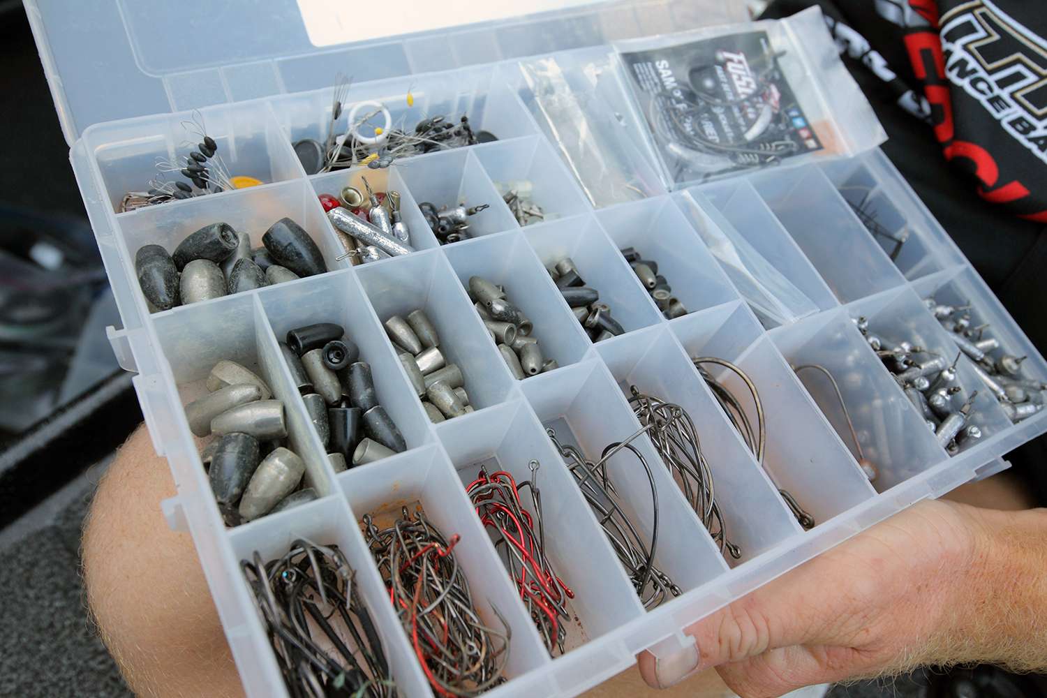 This box holds an organized selection of sinkers and hooks. This box was kept in the front boat compartment because it provided easy access as it's the closest one to Bertrand when he's fishing.