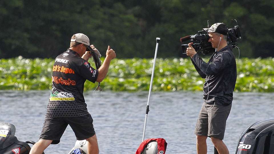 Prince and cameraman Todd Barnes share a thumbs up as itâs a good sign of the fish that live on this spot.