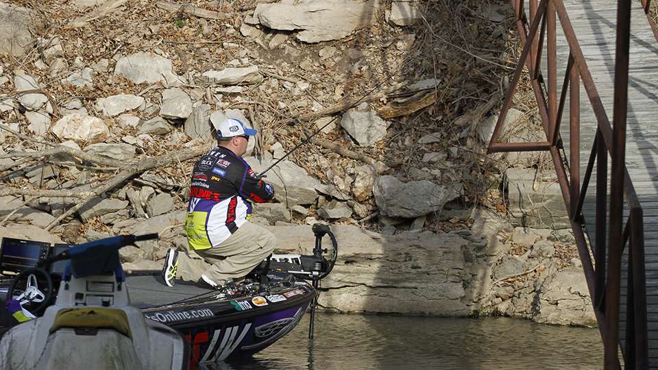 Like other anglers this week, Lowen bends down to navigate his way under walkways and cables.